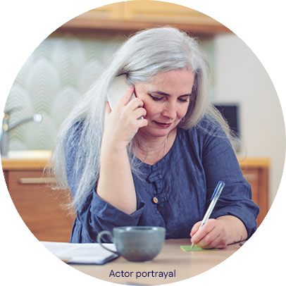 Patient portrayal of woman on a mobile phone taking notes